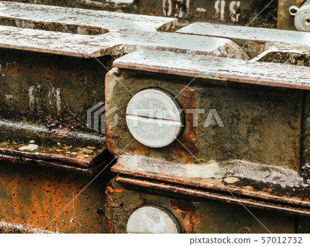 Nut bolt screw fastened in Old zinc rusty grunge 57012732