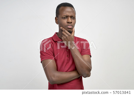 man looks down, tries to remember something 57013841