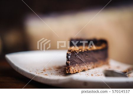 Slice of raw vegan dark chocolate cake Slice of raw vegan dark chocolate cake 57014537