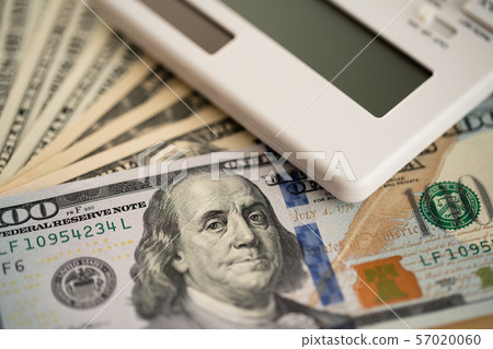 Money and calculator with the image of household finance Money and calculator with the image of household finance 57020060