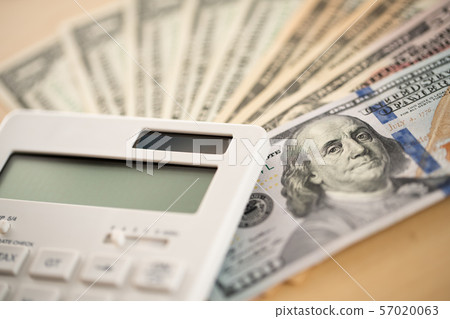 Money and calculator with the image of household finance Money and calculator with the image of household finance 57020063