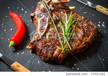 Grilled club steak on slate plate 57021381