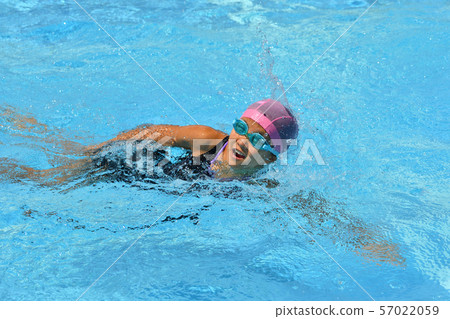 Girl swimming in the pool (crawl) Girl swimming in the pool (crawl) 57022059