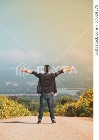 Freedom traveler man standing with raised arms,Top Freedom traveler man standing with raised arms,Top 57024379