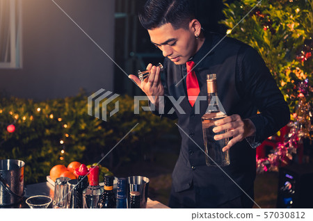 Professional bartender preparing fresh lime Professional bartender preparing fresh lime 57030812