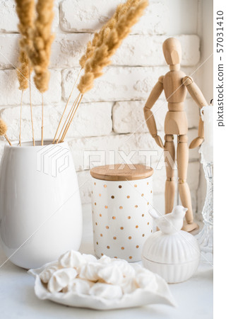 White real home decor, ceramic interior details with vases and candles White real home decor, ceramic interior details with vases and candles 57031410