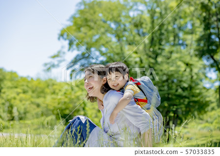Mother and son playing in the park Mother and son playing in the park 57033835