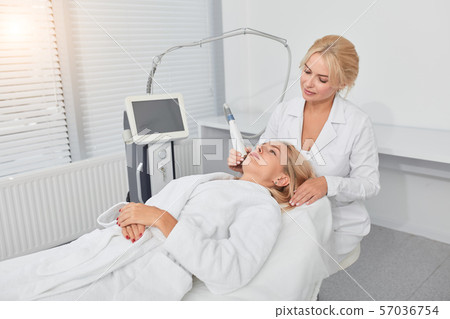 relaxed blonde client treating her unhealthy face relaxed blonde client treating her unhealthy face 57036754