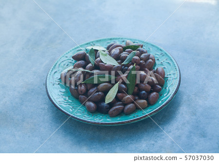 Authentic organic food. Olives on the plate. Authentic organic food. Olives on the plate. 57037030
