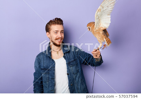 young psychic holding a bird communes with the dead young psychic holding a bird communes with the dead 57037594