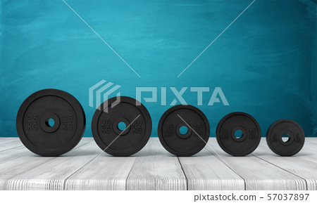 3d rendering of five black weight plates on white wooden floor and dark turquoise background 57037897