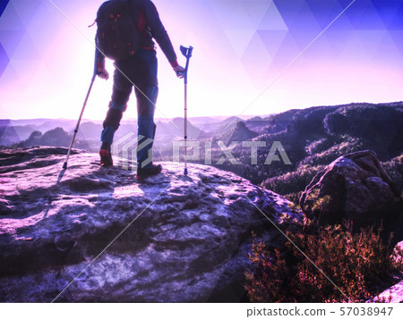 Accident tourist man walk by crutches on path 57038947