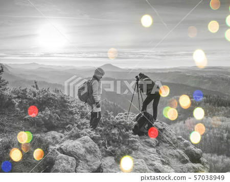 Friends photographers discuss and taking photo 57038949