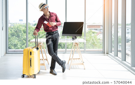 young bussinessman preparing for vacation young bussinessman preparing for vacation 57040044