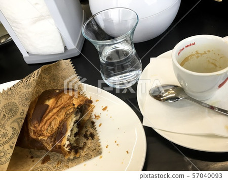 Chocolate croissant with coffee and water Chocolate croissant with coffee and water 57040093