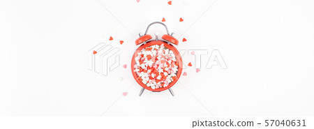 Valentine Day concept with alarm clock and hearts Valentine Day concept with alarm clock and hearts 57040631