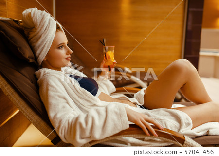 Sexy girl relaxing with cocktail in spa chair 57041456