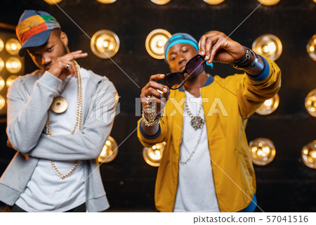 Two black rappers in caps, singers on stage 57041516