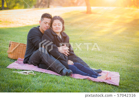 Hispanic Pregnant Young Couple Portrait Outdoors 57042316