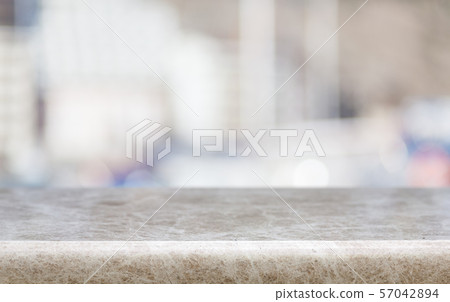 Abstract blur bokeh background with wooden desk Abstract blur bokeh background with wooden desk 57042894