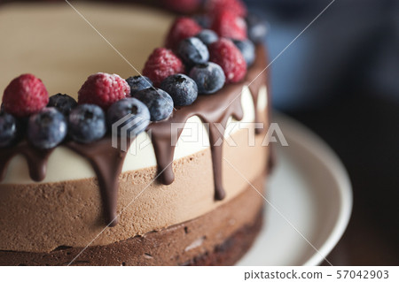 Fresh beautiful chocolate cake with fruit and Fresh beautiful chocolate cake with fruit and 57042903