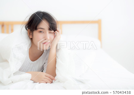 Beautiful portrait young asian woman lying smile 57043438