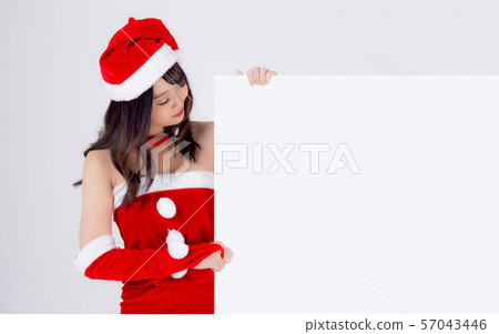 Beautiful young asian Santa woman holding blank board for xmas isolated on white background 57043446