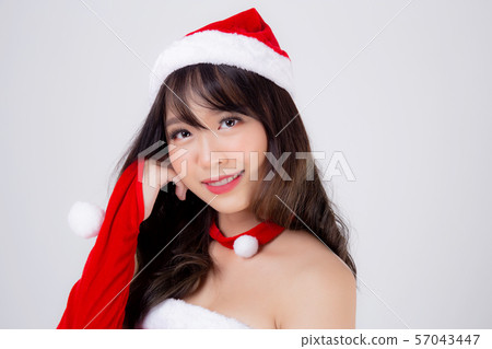 Beautiful portrait young asian woman Santa costume wear hat smiling with happy in holiday Christmas 57043447