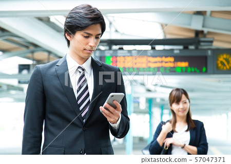 Commuter male train station businessman shooting cooperation: Keio Electric Railway Co., Ltd. 57047371