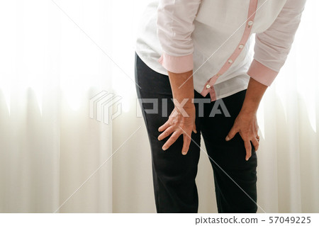 senior woman suffering from knee pain at home, health problem concept senior woman suffering from knee pain at home, health problem concept 57049225