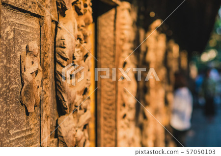 Archaeological, Close Up of carved art figures on old wood carvings on the wall temple at Shwe Nan Daw Kyaung (Golden Palace Monastery) in Mandalay, Myanmar Archaeological, Close Up of carved art figures on old wood carvings on the wall temple at Shwe Nan Daw Kyaung (Golden Palace Monastery) in Mandalay, Myanmar 57050103