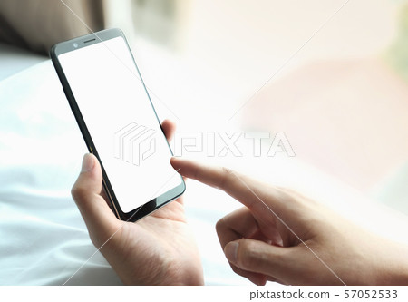 Mockup image of hand holding mobile phone with blank white screen, Blank screen mobile phone Mockup image of hand holding mobile phone with blank white screen, Blank screen mobile phone 57052533