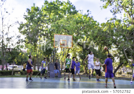 Blurry image of elderly men and teens playing basketball in morning at BangYai Park , Nonthaburi. Blurry image of elderly men and teens playing basketball in morning at BangYai Park , Nonthaburi. 57052782