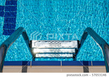 Grab bars ladder in the swimming pool 57053146