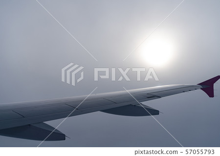view of aircraft wing silhouette and dark blue sky  57055793