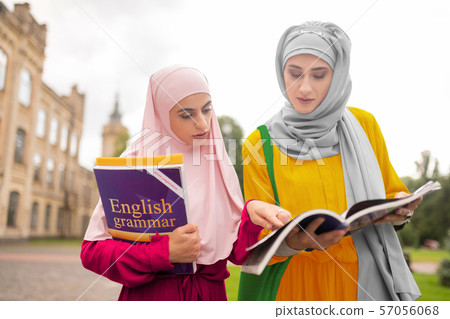 International students repeating English while walking to class 57056068