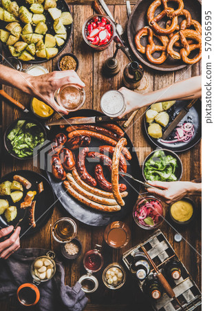 Octoberfest dinner table with beer, sausages and 57056595
