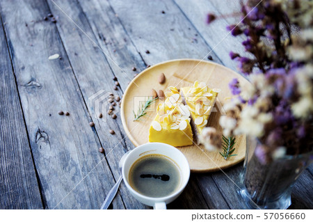 Cake and coffee cup on wood. Cake and coffee cup on wood. 57056660