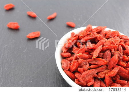 dried goji berries in a small white bowl 57058244