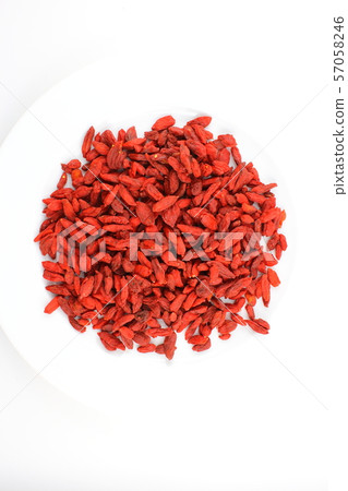 dried goji berries on a white plate food 57058246