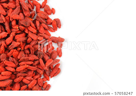 dried goji berries on a white plate food 57058247