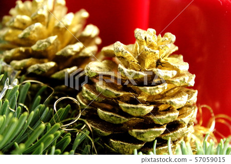golden pine cone on a christmas decoration with 57059015