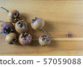 fresh medlar fruits on a wooden board 57059088