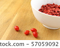 dried goji berries in a small white bowl 57059092