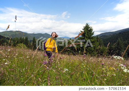 tourist girl standing at the meadow tourist girl standing at the meadow 57061534