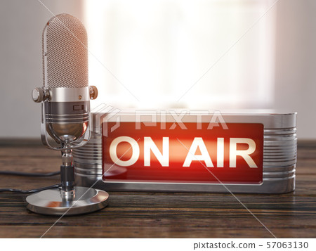 On the air. Old  microphone with vintage signboard 57063130