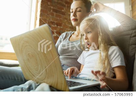 Teacher and little girl, or mom and daughter. Homeschooling concept 57063993