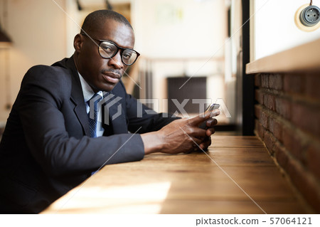 African-American Businessman in cafe African-American Businessman in cafe 57064121