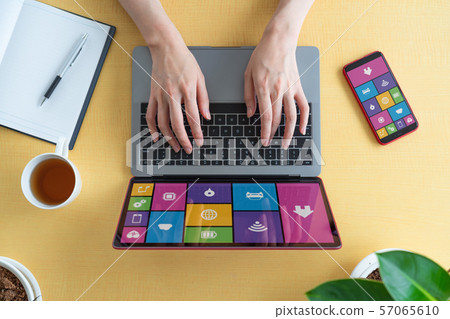 laptop, using laptop, smartphone 57065610