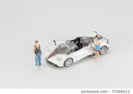 the mini of Sexy couple in the car. Luxury life. 57066012